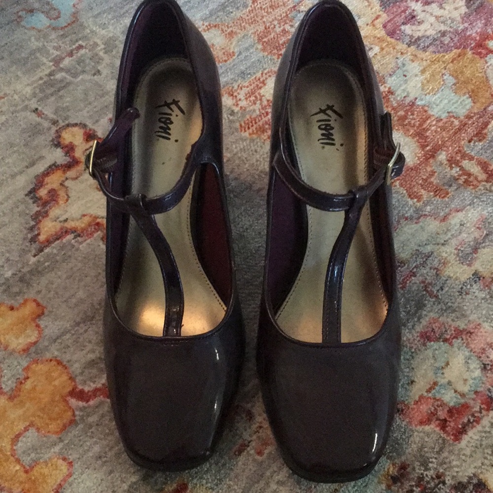 Mary Jane style patent leather shoes.